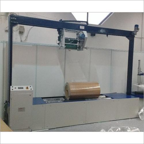 Paper reel wrapping machine